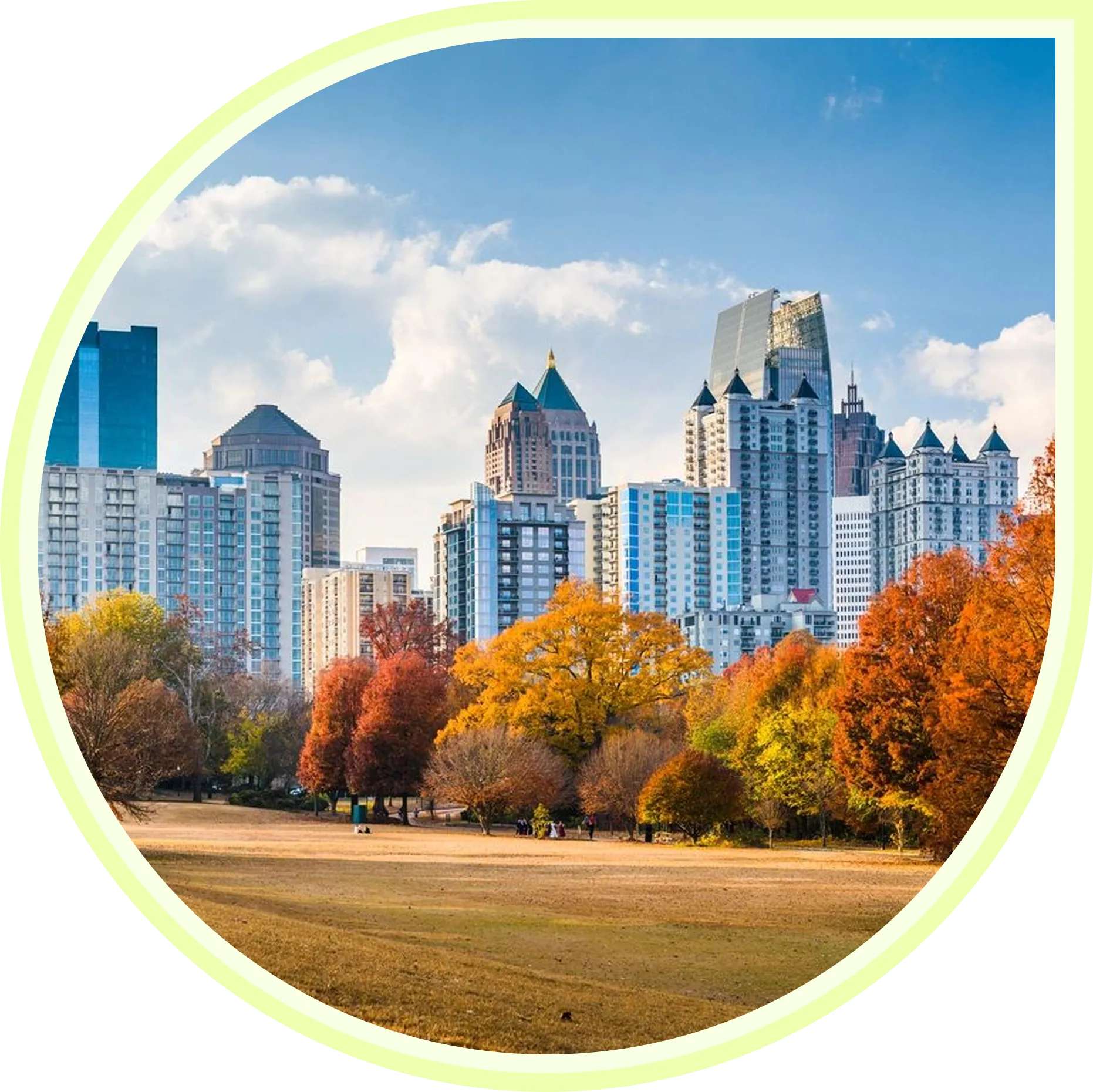 City skyline with autumn trees and park.
